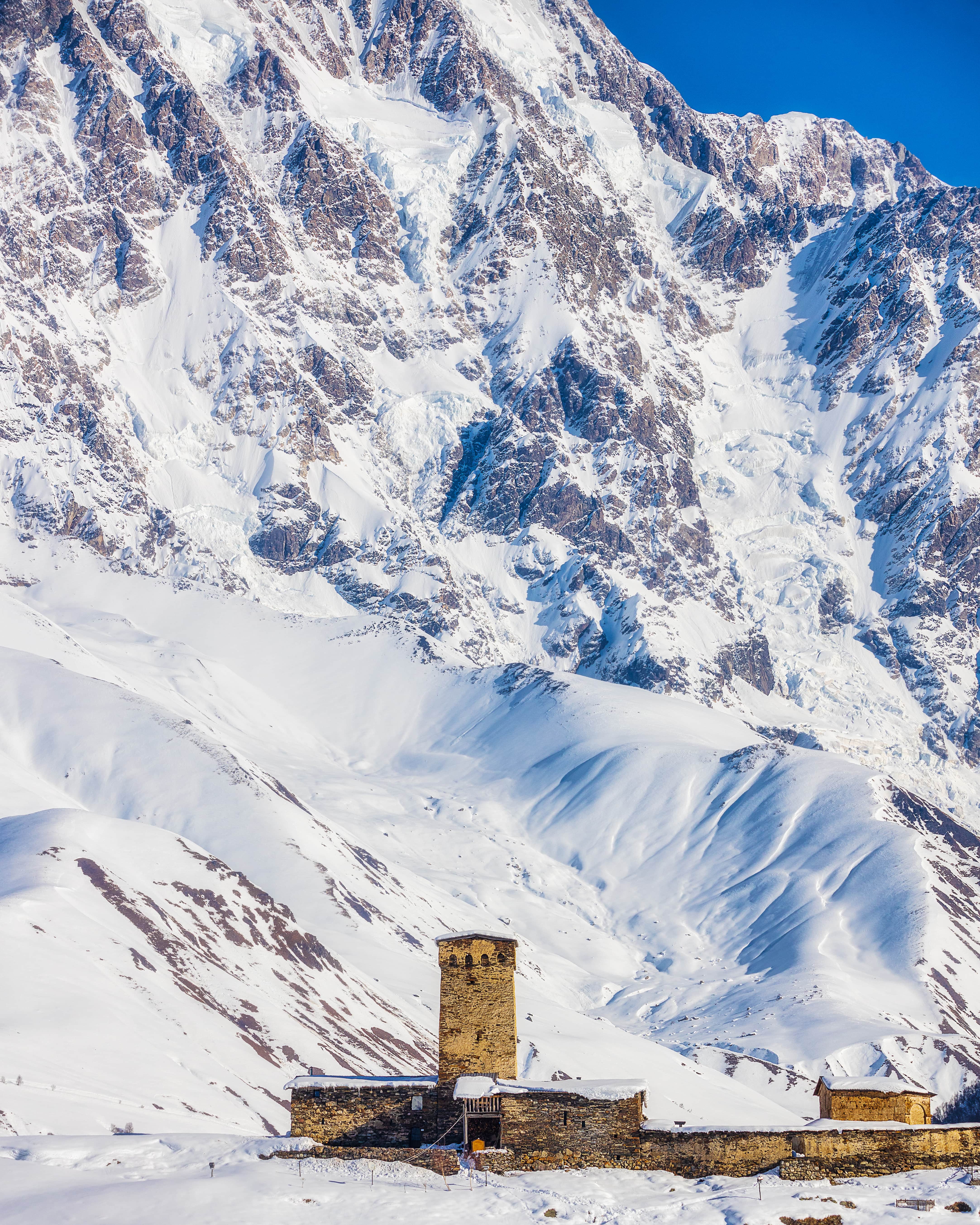 old-lamaria-church-rocky-slopes-shkhara-mountain-ushguli-svaneti-region-georgia-min.jpg